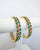 gold plated bangle with multi colour stonework £38 2.4 2.6 2.8