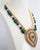 gold plated 2 line pearl bllue and green kundan pendant with earrings